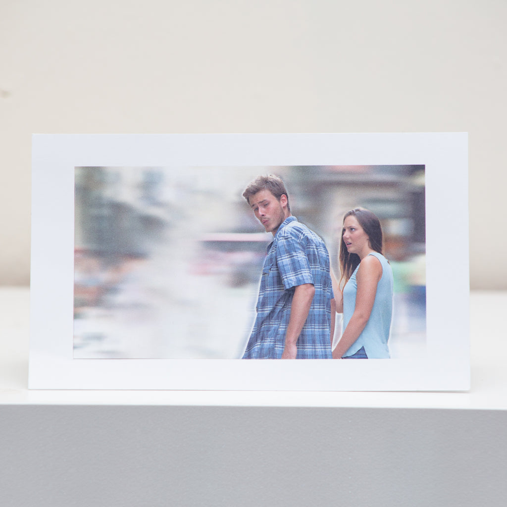 Distracted Boyfriend Meme Postcard Display.