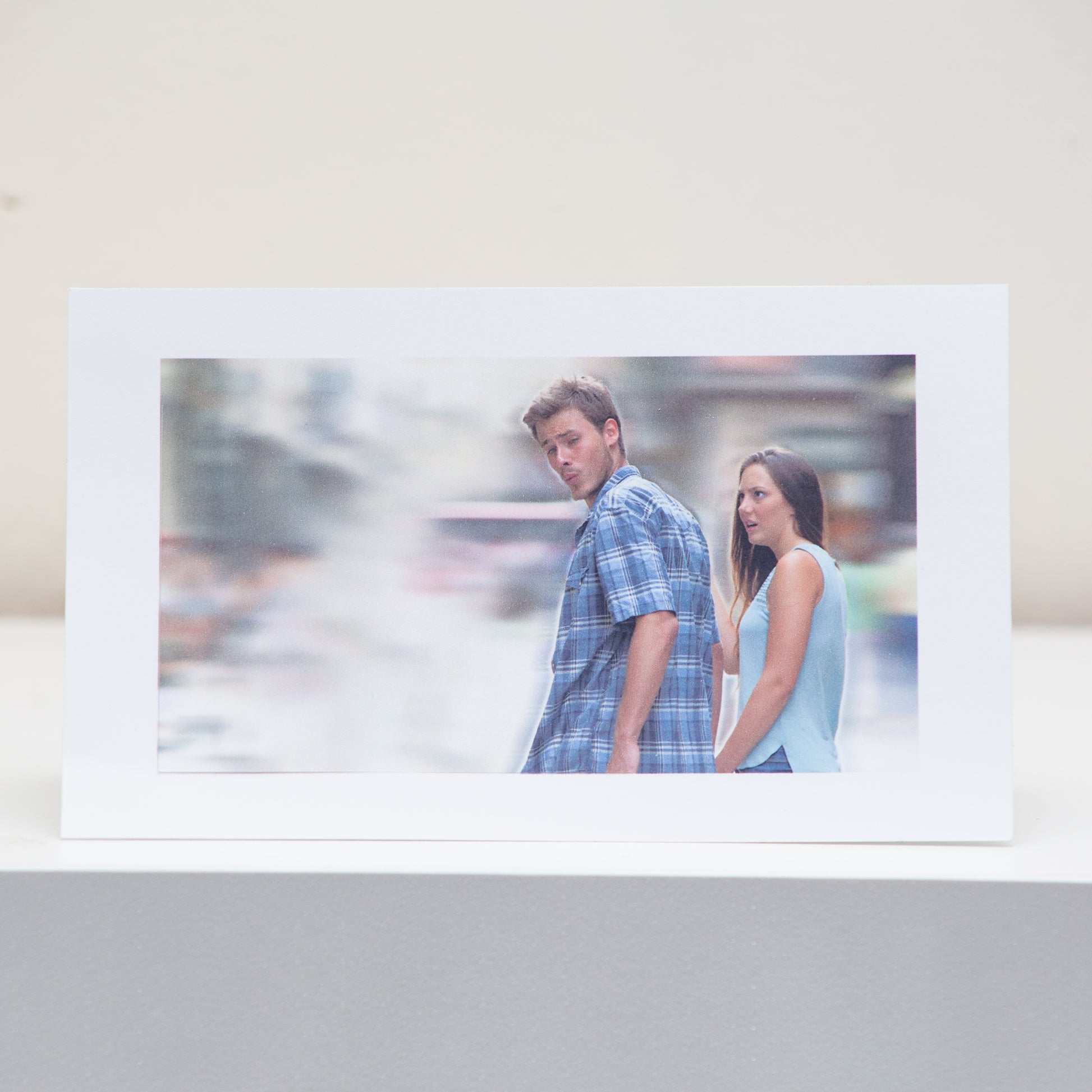 Distracted Boyfriend Meme Postcard Display.